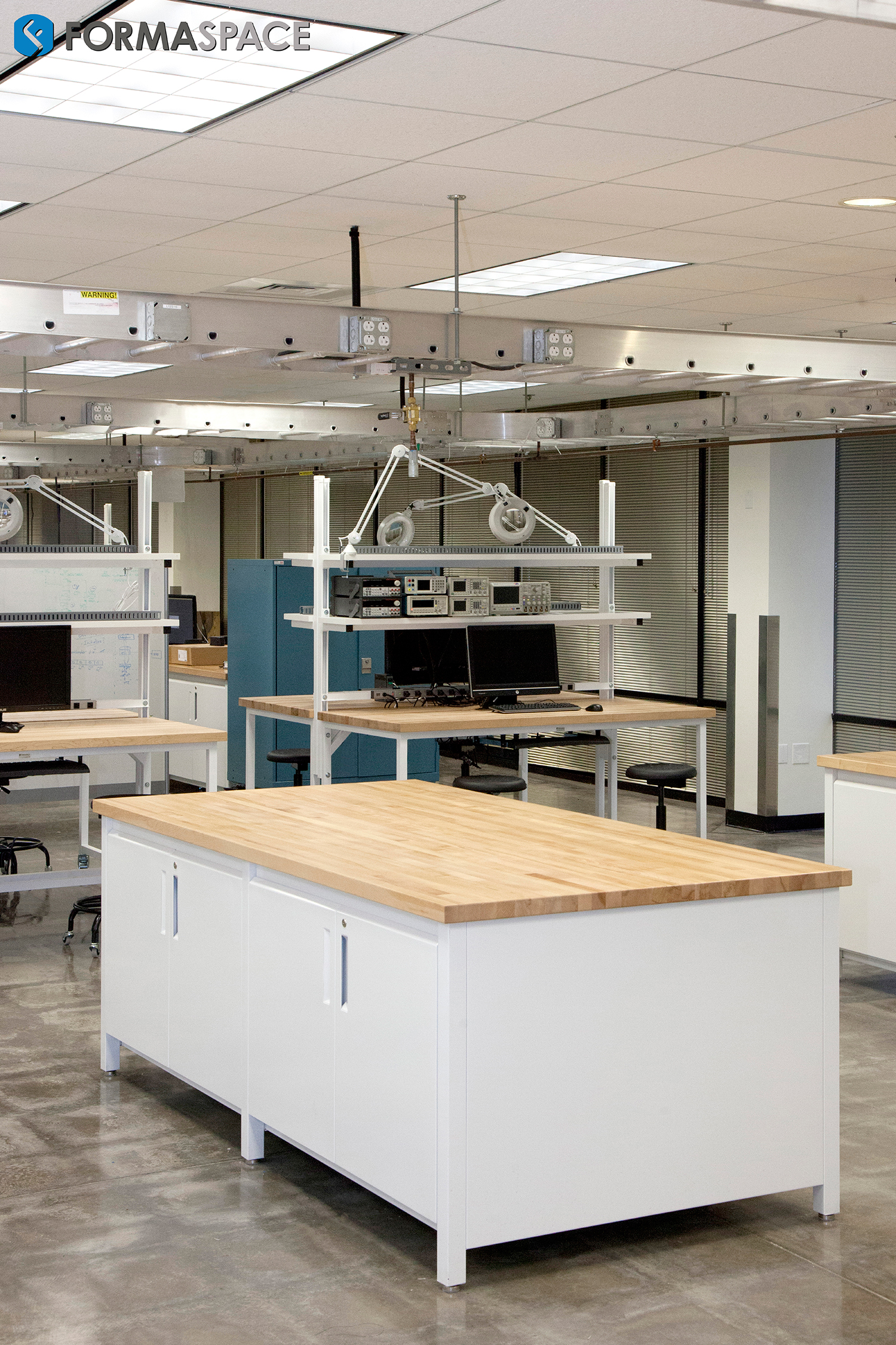 Highter Education Innovation Lab with Collaborative Islands and Designated Workstations