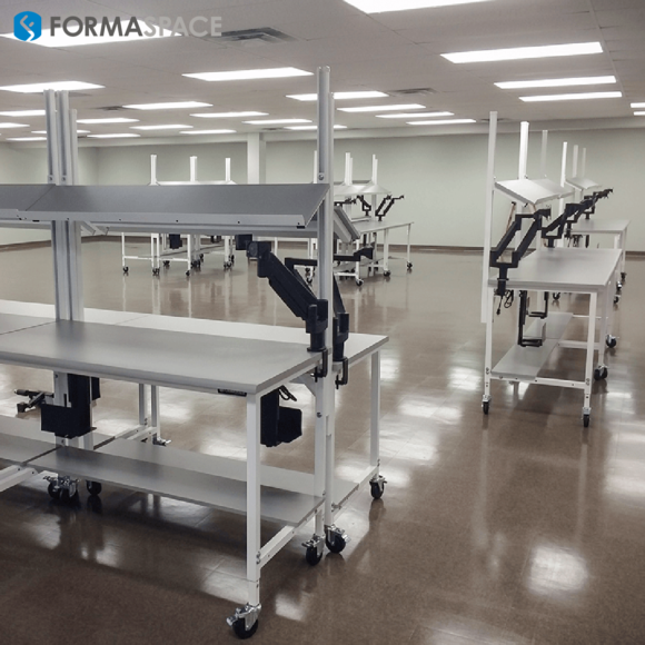 mobile workbenches with PLAM worksurfaces for a pharmacy order-filling facility