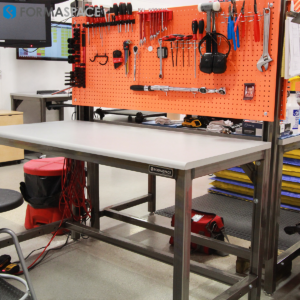 Manufacturing Workbenches with Orange Pegboards