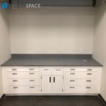 Gray Epoxy Top Casework with White Cabinetry