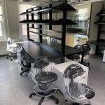 lab workbenches in a row with shelving