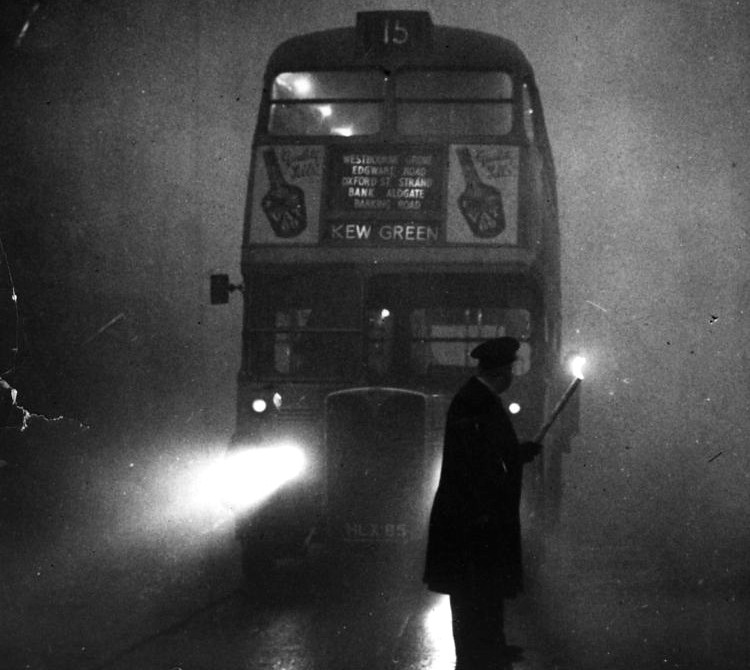 Black & White London bus with a transit inspector assisting